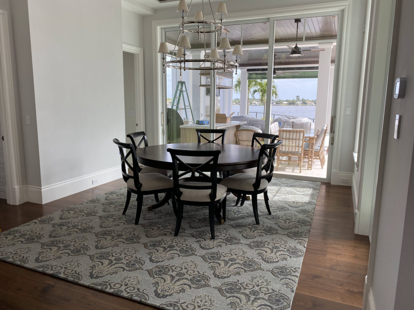 An elegantly patterned rug beneath a dining table