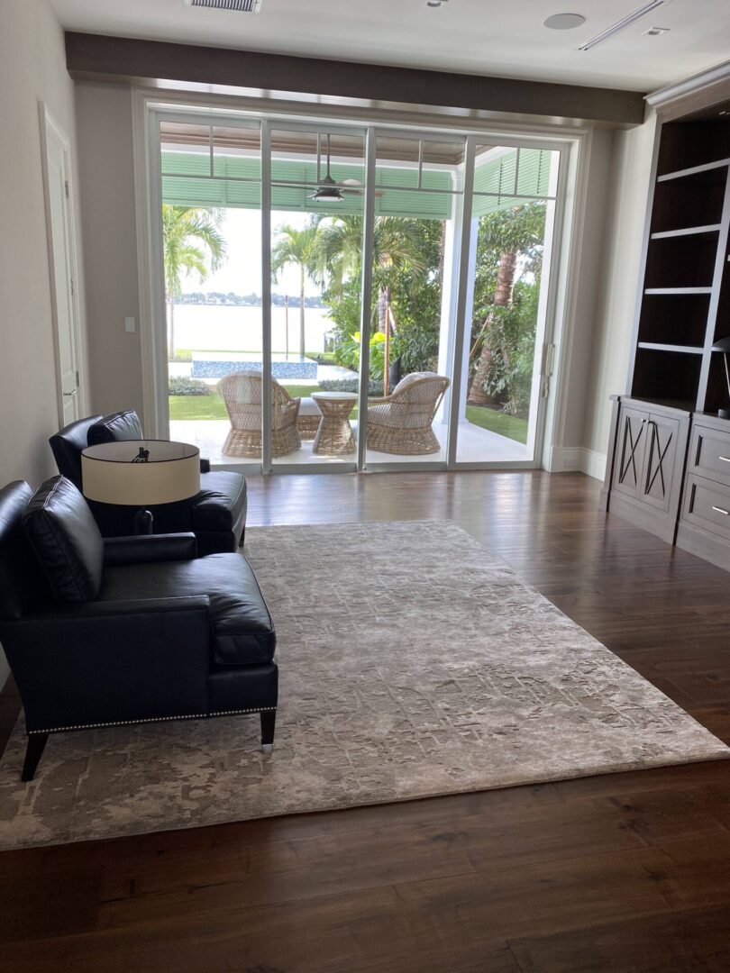 A living room with an off-white carpet